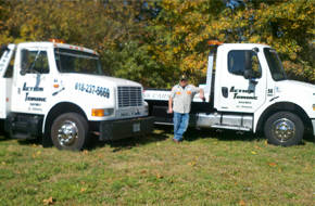 Two Action Towing white trucks and driver, Mount Vernon Illinois